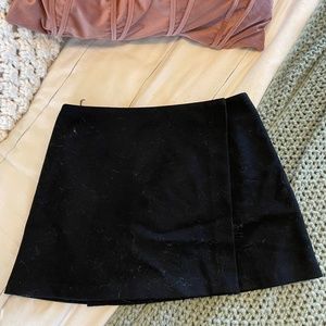 Black button mini skirt